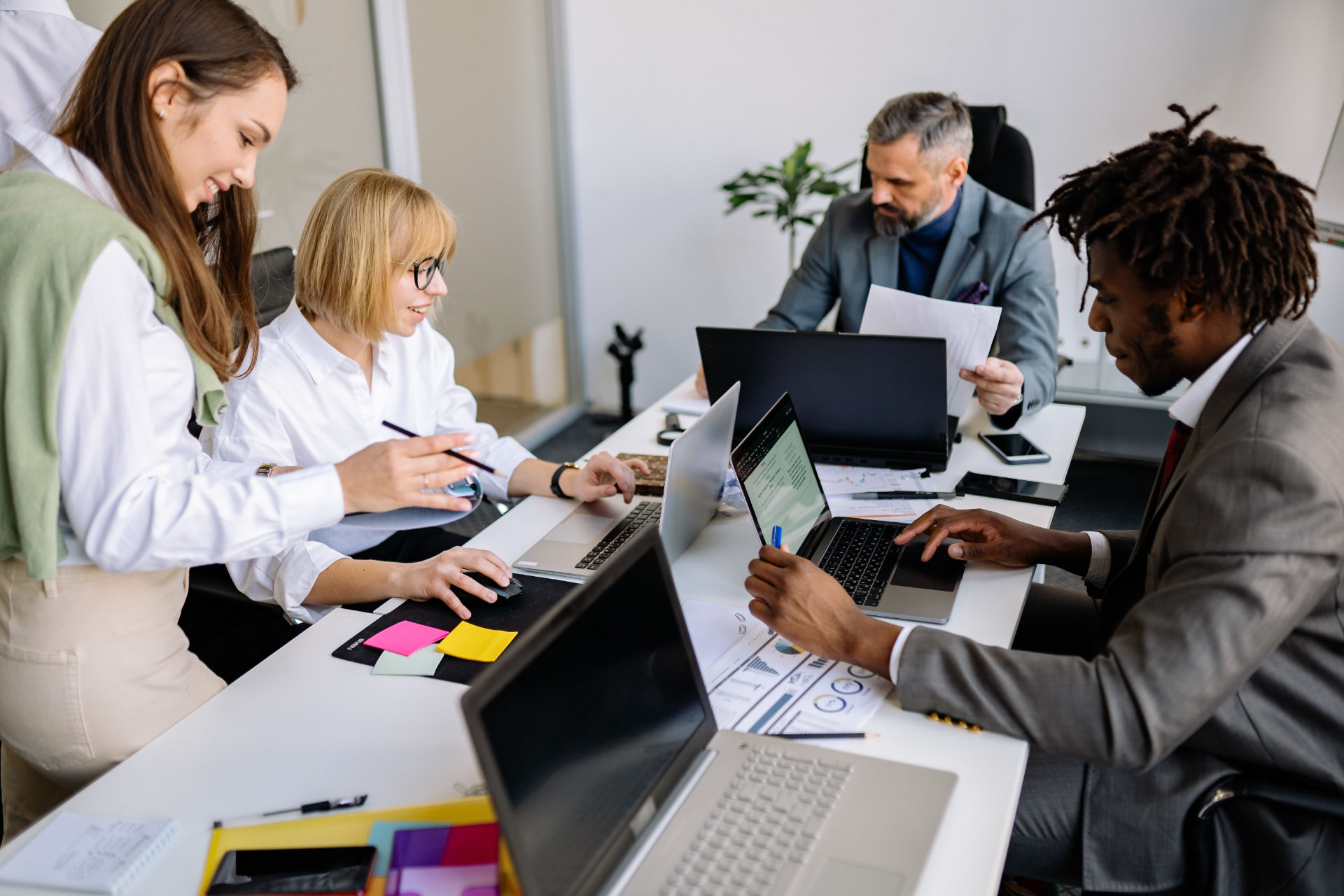 Cannixus revenue operations team reviewing claims data on monitors